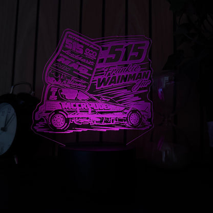 Purple laser cutout of a geometric design on a dark surface of 515 frankie wainmann jnr stockcar and banger racing merchandise and night light