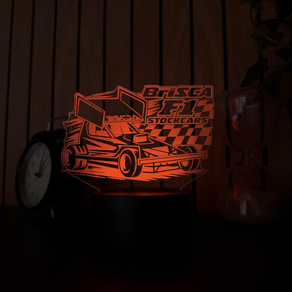 Brisca F1 stock car acrylic night light orange  LED on bedside table next to alarm clock