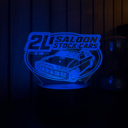 Blue illuminated sign with '2L Saloon Stock Cars' logo on a dark background